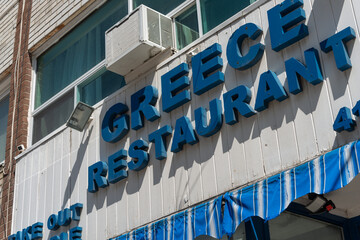 Fototapeta premium exterior of Greece Restaurant located at 643 Mount Pleasant Road in Toronto, Canada