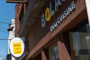 Fototapeta premium exterior projecting sign and facade of Bolan Thai Cuisine located at 709 Mount Pleasant Road in Toronto, Canada