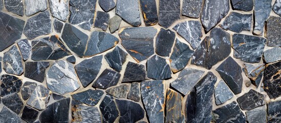 The background is a blend of gray and blue stone granite, black and white marble, and sandstone with small pieces of sand tile.