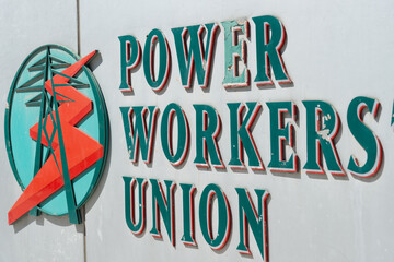Fototapeta premium exterior sign of Power Workers' Union, a labor union, located at 244 Eglinton Avenue East in Toronto, Canada