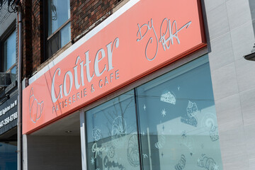 Fototapeta premium exterior building and sign of Goûter, a patisserie, located at 300 Eglinton Avenue West in Toronto, Canada
