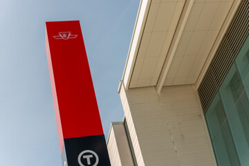 Fototapeta premium red location marker outside an Eglinton Crosstown station in Toronto, Canada