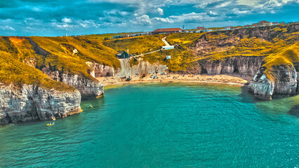 Beach in between cliffs landscape