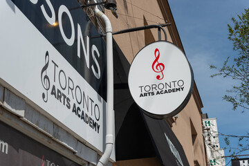 Fototapeta premium exterior projecting or hanging sign at Toronto Arts Academy, a music school, located at 386 Eglinton Avenue West