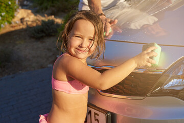 Child, car wash and portrait with helping for fun in summer for development with learning, smile...