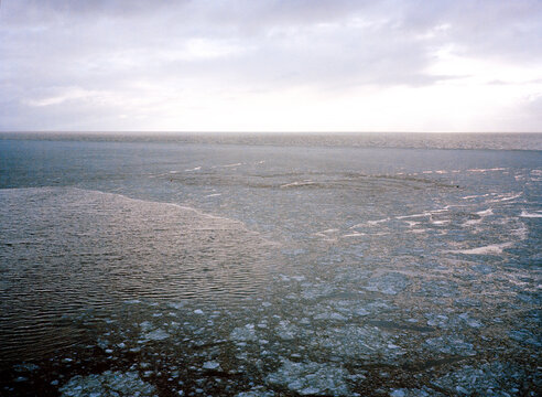 Analog image of a frozen sea at sunset