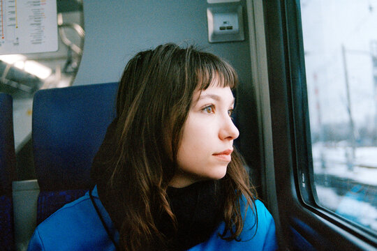 Analog portrait of a woman in a train