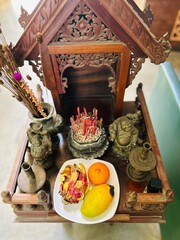 brightly colored Chinese and Cambodian Buddhist alter in Phnom Penh Cambodia