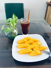 cut mango with coffee - travel texture in Cambodia