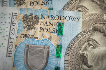 Narodowy bank Polski sign on Banknote economy in Poland inflation concept - obrazy, fototapety, plakaty