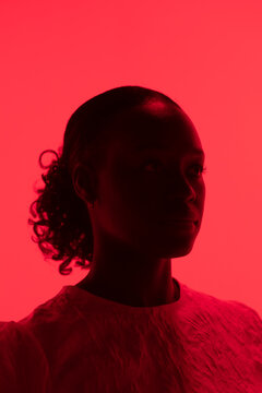 Woman silouette with red lightning