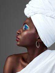 African, woman and creative makeup in fashion and pride in beauty of indigenous culture. Studio,...