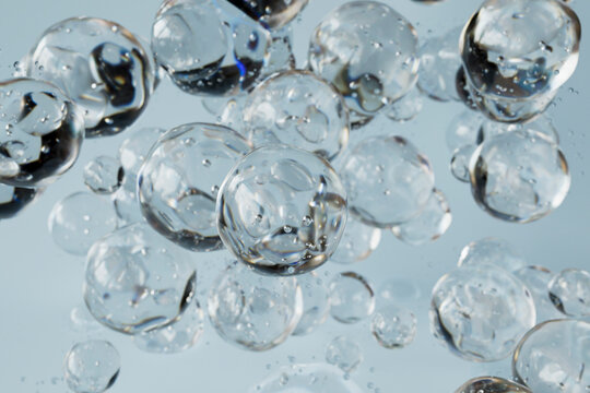 Crystal Clear Water Bubbles Floating Against Sky Blue Background