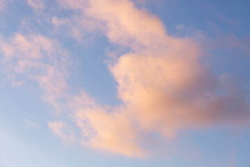 Peachy clouds in a blue sky