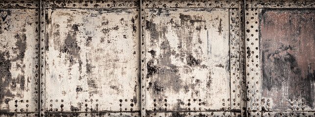 Photo closeup old rusty grunge steel aluminum fragment of protective structure made of metal plates...