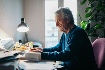 Man working in cluttered desk