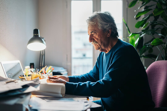 Man working in cluttered desk