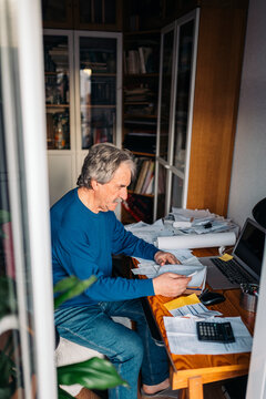 Man working in cluttered desk
