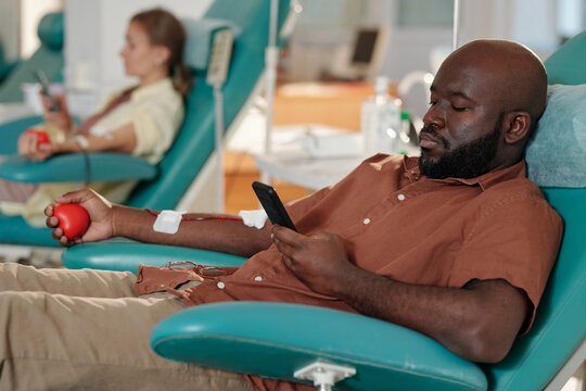 Man Relaxing During Blood Collection Procedure