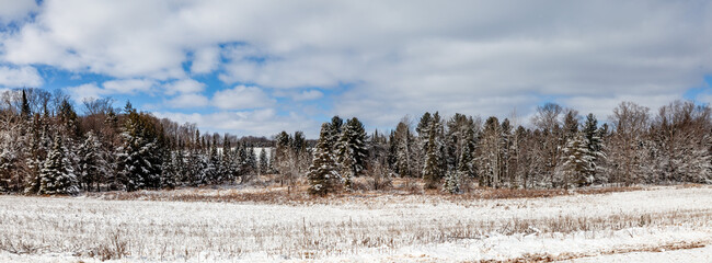 Wisconsin farmland and forest covered in snow