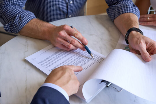 Buyer signing Contract of sale for apartment 