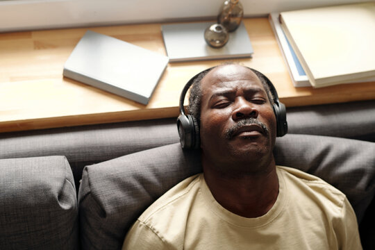 Senior Black Man Listening To Music