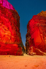 Illuminated canyon and acient Nabatean city of Petra by night, Jordan