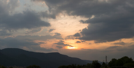 Sunset over the town of Sarnitsa, located in the Western Rhodope Mountains near the Dospat Reservoir.