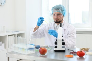 Quality control. Food inspector checking safety of products in laboratory