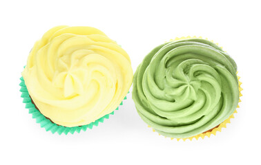 Different tasty cupcakes with cream isolated on white, top view
