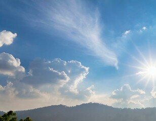 The sky has the light of the sun, the sky is blue, there are small and large clouds alternating and moving slowly, with the sunlight passing, creating a miraculous abstract shape, a hot day