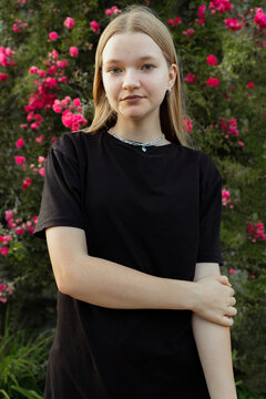 Portrait of teen girl in black plain T-shirt 