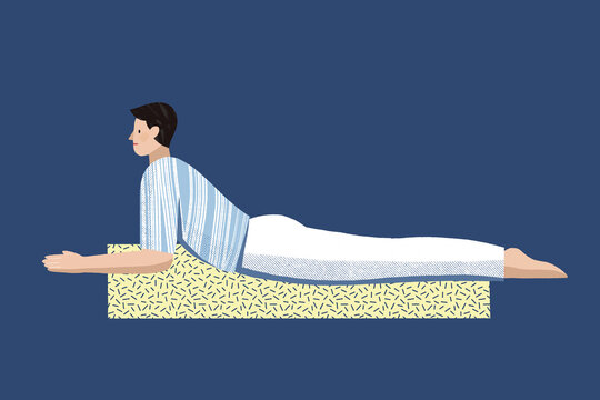 Caucasian man practising hatha yoga for beginners in bhujangasana
