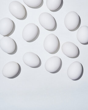 White Eggs Arrayed on Bright Surface in Daylight