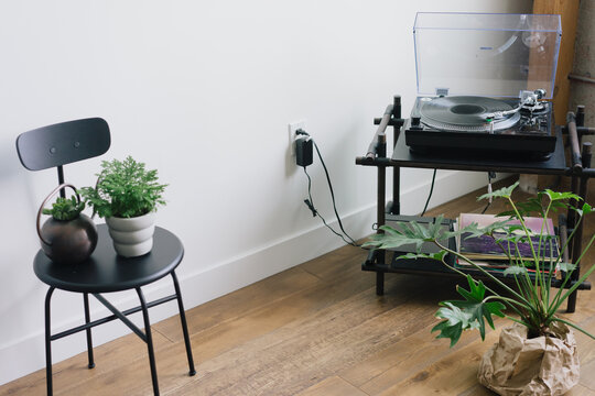 Record player in a stylish LA loft with plants.