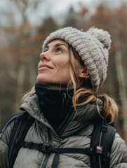 A woman wearing a hat and jacket looking up at the sky. Generative AI.