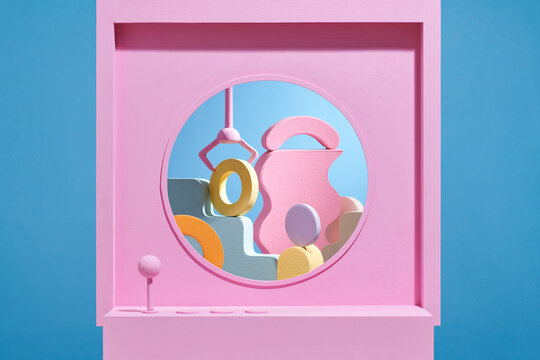 Geometric product falls from the gripper arm an automatic crane toy