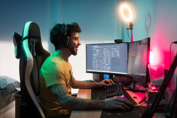 Smiling gamer online gaming with friends
