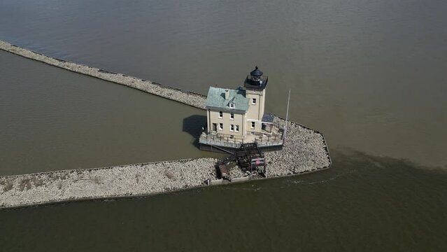 rondout lighthouse aerial footage (drone flying trace tracing circle circling) scenic travel destination in catskills on hudson river creek (light house beacon light guiding boats to shore) maritime