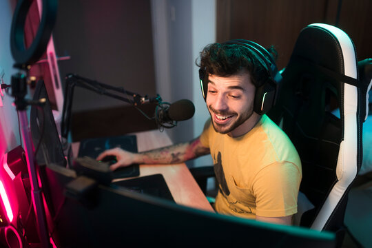 Gamer having fun and live streaming at home