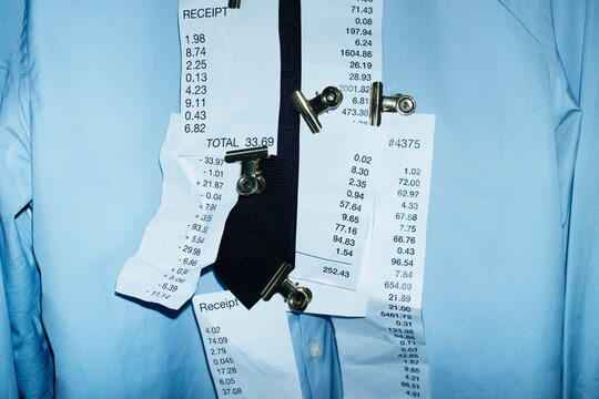 Formal office business shirt and tie and paper receipts with clips 