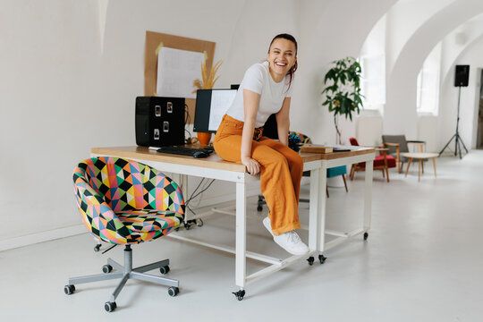 Happy young female generation z in the office 