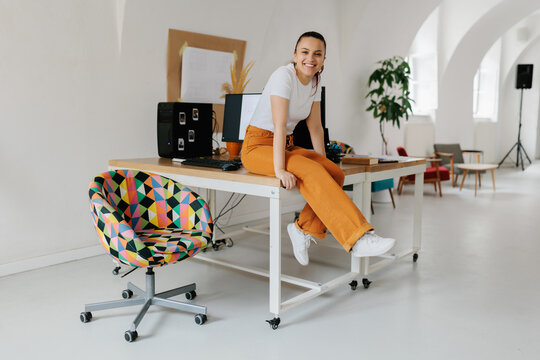 Happy young female generation z in the office 