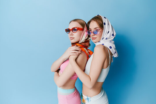 Studio portrait of sisters in summer outfit