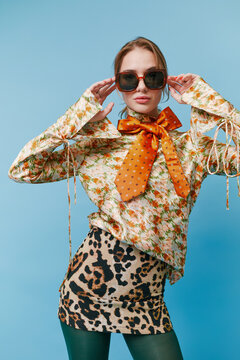 Fashion model posing over studio background