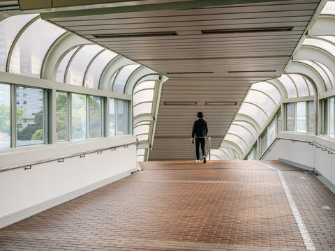 young boy walking down a passageway