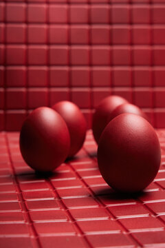 Five Red Eggs on Textured Surface