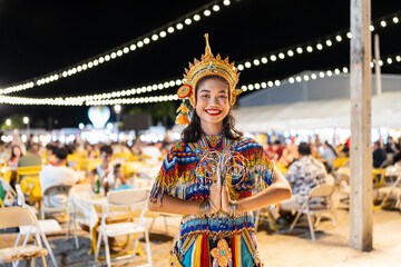 Smiling woman in traditional costume.