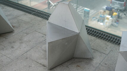 Metal public bench with modern geometric design