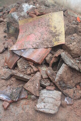 Piles of dirt, bricks and tiles from used buildings